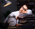 Young businessman working overtime late in office Royalty Free Stock Photo