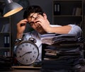 Young businessman working overtime late in office Royalty Free Stock Photo