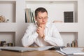 Young businessman in a workplace with surprise and shocked facial expression Royalty Free Stock Photo