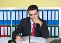 Young businessman writing a note at office Royalty Free Stock Photo