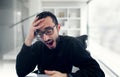 Young businessman yawning at work in office . Royalty Free Stock Photo