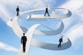 Young businessmans walking on curve arrow on blue sky background