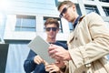 Young Businessmen Using Tablet Outdoors Royalty Free Stock Photo