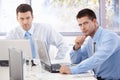 Young businessmen working at meeting table