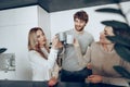 Young businesspeople colleagues having a coffee break in office, drinking and talking Royalty Free Stock Photo