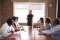 Young Businesswoman Addressing Boardroom Meeting Royalty Free Stock Photo