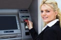 Young businesswoman at the ATM