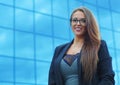 Young businesswoman blue building background successful professional