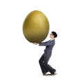 Young businesswoman carry golden egg