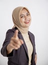young businesswoman cheerful pointing at the camera office work concept