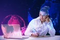 Young businesswoman doing paperwork and desk with laptop and glowing falling red forex chart and globe on blurry background.