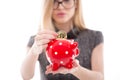 Young businesswoman drop bitcoin into piggy bank isolated Royalty Free Stock Photo