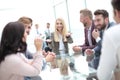 Young businesswoman explaining new tasks at a working meeting. Royalty Free Stock Photo