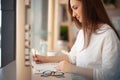 Young businesswoman in eyeglasses planning and writing down the daily schedule with in agenda Royalty Free Stock Photo