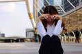 Young businesswoman feeling failure and frustrated with her work. Stressed business concept. Selective focus and shallow depth of