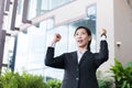 Young businesswoman feeling successful outside office building. Royalty Free Stock Photo