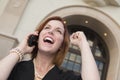 Young Businesswoman with Fist in Air On Cell Phone Royalty Free Stock Photo