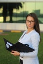 Young Businesswoman with Folder - Stock Image Royalty Free Stock Photo