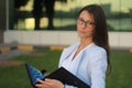 Young Businesswoman with Folio - Stock Image Royalty Free Stock Photo