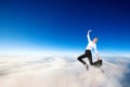 Young businesswoman in formal wear flying in blue sky. Royalty Free Stock Photo