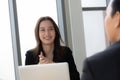 Young businesswoman giving a presentation to a young businessman boss. Royalty Free Stock Photo