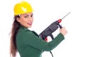 Young businesswoman with hard hat holding a drill