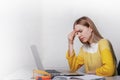 Young businesswoman has headache during work. Girl with laptop Royalty Free Stock Photo