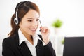 Young businesswoman with headset in office Royalty Free Stock Photo