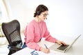 Call center operator businesswoman wearing headset and using laptop while working from home Royalty Free Stock Photo