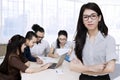 Young businesswoman and her team Royalty Free Stock Photo