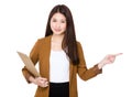 Young businesswoman hold with clipboard and finger point away Royalty Free Stock Photo