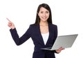 Young businesswoman hold with laptop computer and finger point u Royalty Free Stock Photo