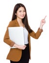 Young businesswoman hold with laptop computer and finger point u Royalty Free Stock Photo