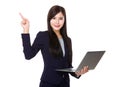 Young businesswoman hold with laptop computer and finger pointing up Royalty Free Stock Photo