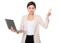 Young businesswoman hold with notebook computer and finger point Royalty Free Stock Photo