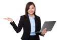 Young Businesswoman hold with notebook computer and hand showing Royalty Free Stock Photo