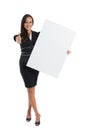 Young businesswoman holding at blank card in her hand Royalty Free Stock Photo