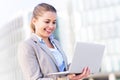 Young businesswoman holding laptop Royalty Free Stock Photo