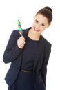 Young businesswoman holding a lolipop