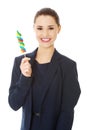 Young businesswoman holding a lolipop