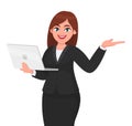 Young businesswoman holding a new digital laptop computer and presenting or pointing hand to copy space. Female character design. Royalty Free Stock Photo