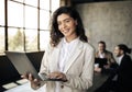 Young Businesswoman With Laptop Standing Near Coworkers Group In Office Royalty Free Stock Photo