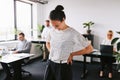 Young businesswoman laughing at work