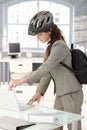 Young businesswoman leaving office by bike Royalty Free Stock Photo