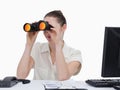 Young businesswoman looking through binoculars Royalty Free Stock Photo