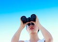 Young businesswoman looking through binoculars Royalty Free Stock Photo