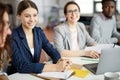 Young Businesswoman at Meeting Table