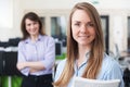 Portrait Of Young Businesswoman With Mentor In Office Royalty Free Stock Photo
