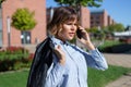 Young businesswoman in park calling by phone