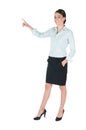 Young businesswoman pointing, isolated